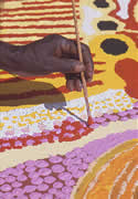 Balgo artist applying paint