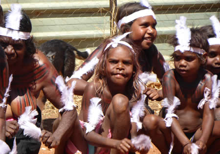 Girls dancing at Warlukurlangu Artists before museum opening